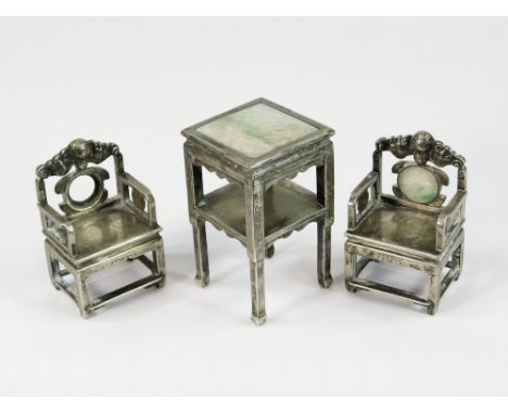 CHINESE SILVER. A pair of Chinese silver & jade miniature armchairs & a similar tall table (one chair with missing jade & one