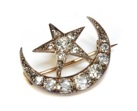 A late Victorian diamond set crescent and star brooch,with graduated old cushion cut, old European cut, old Swiss cut and ros