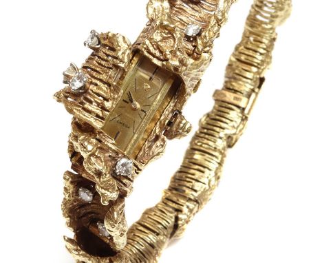 A ladies' 18ct gold diamond set Omega mechanical cocktail bracelet watch, c.1970,of graduated, twisted ribbon form, with scat
