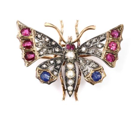 A split pearl ruby, sapphire and diamond butterfly brooch, c.1900,with graduated split pearls forming the abdomen and thorax,