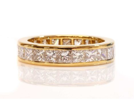 A diamond set full eternity ring,with a row of princess cut diamonds, with a total stated weight of 3.50ct, all channel set t