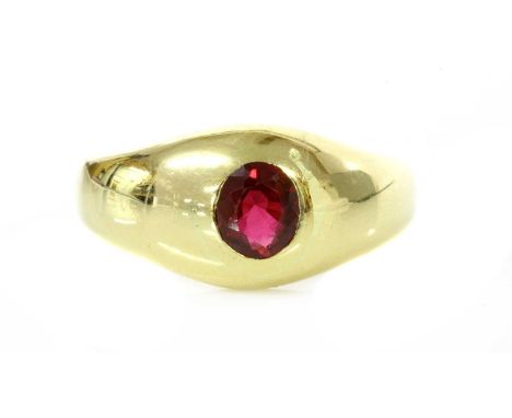 A gentlemen's single stone unheated ruby ring,with an oval mixed cut ruby, estimated as approximately 0.80ct, gypsy set in a 