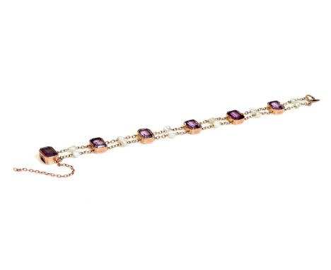 A rose gold amethyst and pearl bracelet, c.1910,with a series of cut corner step cut amethysts, each one milligrain set in a 