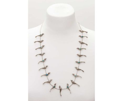A silver Navajo bird necklace,with alternating turquoise set and incised birds, strung between silver beads to a hook clasp. 