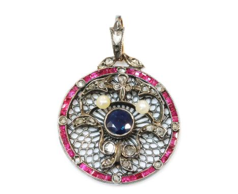An Edwardian sapphire, ruby, diamond and pearl pendant, c.1910,with a circular mixed cut sapphire, milligrain set to the cent