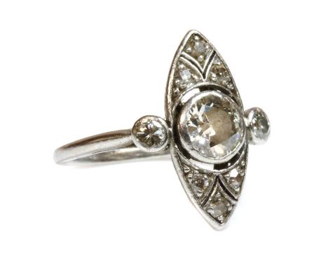 An Art Deco platinum marquise shaped diamond set ring,with an old European cut diamond rub set at the centre of an open marqu