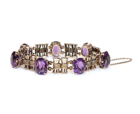 A gold amethyst bracelet, c.1945-1955,with a series of oval mixed cut amethysts, all claw set in pierced collets. Each collet