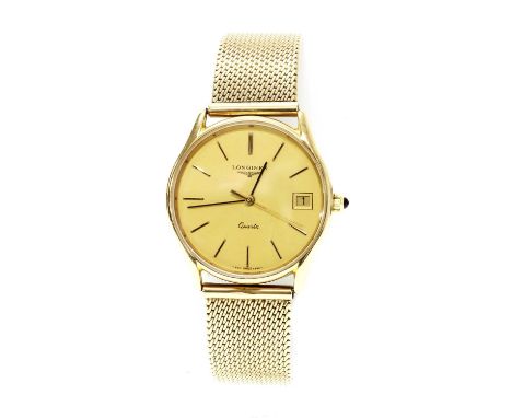 A gentlemen's 9ct gold Longines quartz watch, c.1980,on a later 9ct gold bracelet by W. H. Wilmot. A 33mm case with raised gi