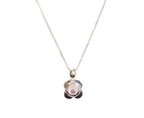 An 18ct white gold single stone pink sapphire pendant,with a circular mixed cut pink sapphire, rub set in a plain collet, fre