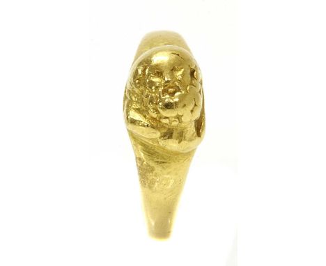 A high carat gold cameo ring,with the head of a bearded gentleman, possibly St Paul, in a landscape position, to a tapered sh