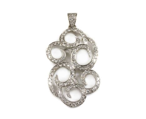 A white gold diamond set scrolling pendant, with a series of graduated scrolls, all milligrain set with rows of graduated bri
