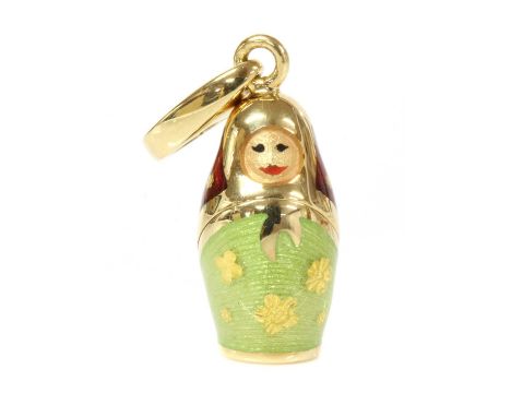 A cased Victor Mayer for Fabergé enamel pendant, in the form of a matryoshka doll or Russian doll, with green, light green an