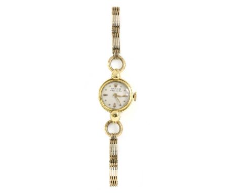 A ladies' 18ct gold Rolex 'Precision' mechanical bracelet watch,a circular case 15.50mm diameter, with a silvered dial, raise