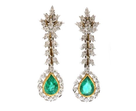 A pair of two colour gold emerald and diamond drop earrings,with a white leaf top, grain set with graduated brilliant cut dia