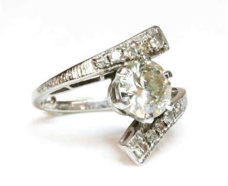 A single stone diamond ring,with diamond set shoulders, with a brilliant cut diamond with an estimated weight of 1.65ct, six 