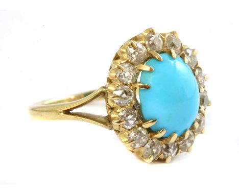 A Victorian turquoise and diamond oval cluster, later mounted as a ring. An oval cabochon turquoise, claw set and surrounded 