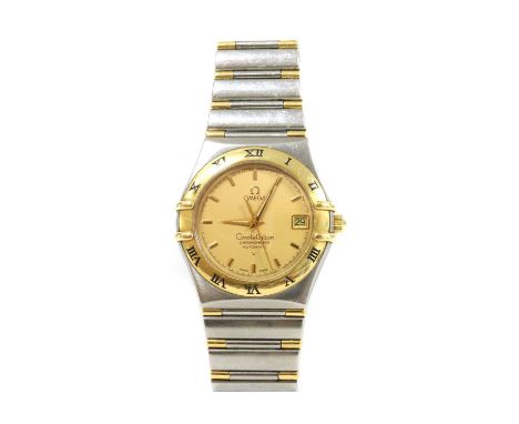 A gentlemen's bi-colour Omega 'Constellation' automatic chronometer bracelet watch,with a 35mm case. A textured champagne dia