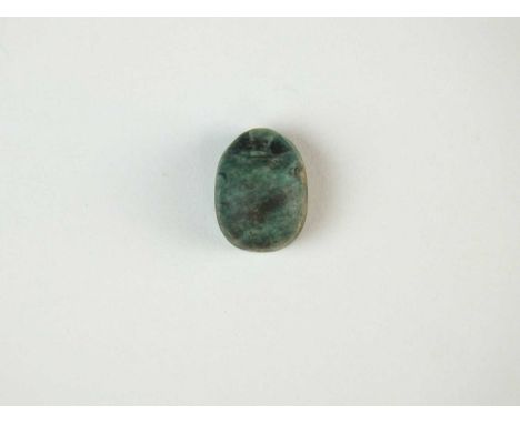 Faience scarab with plain body, the head being defined; pierced for suspension. To the underside is a large “Djed” pillar.To 