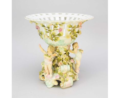 A Schierholz Plaue porcelain centrepiececirca 1900-1910designed as a pierced bowl encrusted with flowers and foliage, support