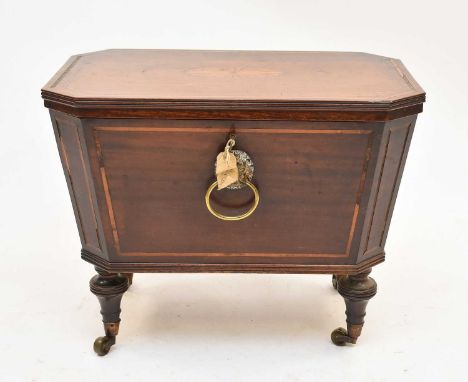 A Regency mahogany sarcophagus form wine cooler, inlaid with sycamore banding and a double fan motif on the top, of tapering 