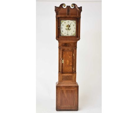 A George III cross-banded oak painted dial longcase clock, the hood with swan neck pediment and inlaid square columns, the tr