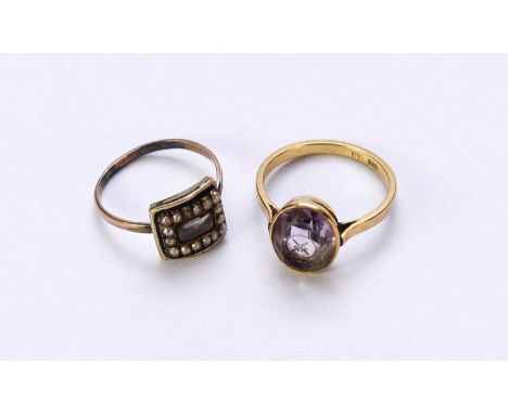 An enamel and seed pearl mourning ring, the reverse with engraved presentation, ring size S, together with an oval amethyst c