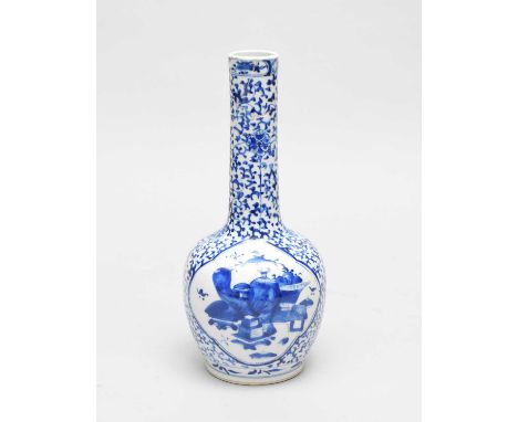 A group of Chinese blue and white porcelain, including a Kangxi style bottle vase, 30cm, (rim repaired), a small dragon sleev