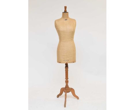 A Levine tailor's dummy, first half 20th century, comprising upper torso, linen lined and set on a turned walnut tripod base,