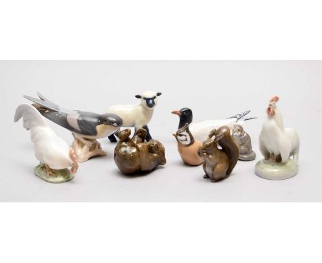 A group of eight Royal Copenhagen animals comprising a pair of cockerels, models 1126 and 1127; a brown squirrel; a bear cub,