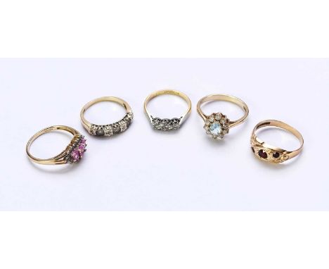 A 9ct gold three stone garnet set ring, size O, together with a 9ct gold pink sapphire and diamond cluster ring, size Q, a th