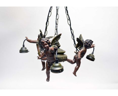 A reproduction bronze effect composite figural three-branch electric ceiling light, late 20th century, modelled as three putt