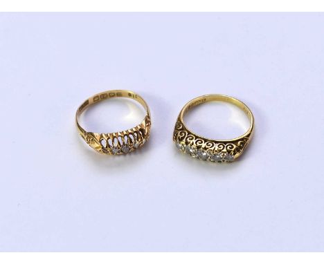 An early 20th century 18ct gold graduated five stone diamond ring, size M 1/2, together with an 18ct gold Victorian style gra