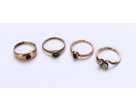 A 9ct gold green paste ring, together with a 9ct gold stone set ring, a single stone garnet ring stamped '9ct' and a paste se