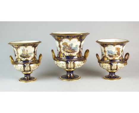 A garniture of three Derby porcelain vasescirca 1820of campagna form, fully painted all around with individual panels of wind