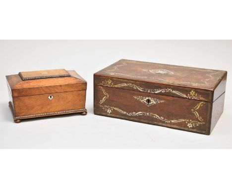 A Victorian rosewood work box, of sarcophagus form, the top with gadrooned panel inset with a mother-of-pearl lozenge, openin