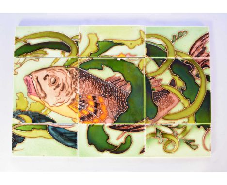 A tile panel attributed to Maw &amp; Co, the three tiles with tubelined decoration and coming together to form a fish in seaw