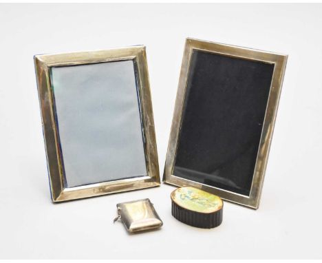 A silver mounted rectangular photograph frame, Sheffield 2003, 17cm x 11.5cm, together with a further silver mounted photogra