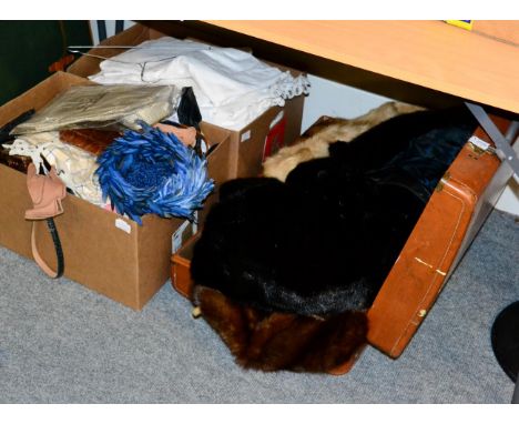 Suitcase of fur capes, throws, stoles, muffs; together with black fur long coat 
