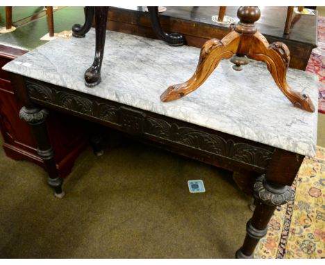 A Victorian carved oak console table with a veined grey marble top 