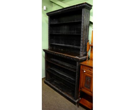 A late Victorian carved oak open shelf bookcase 