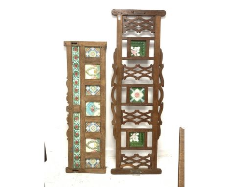 Two Hardwood panels with pierced decoration and inset ceramic tiles 