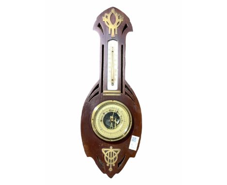 Early 20th century mahogany cased aneroid barometer and thermometer in the Secessionist style, the pierce carved case with br