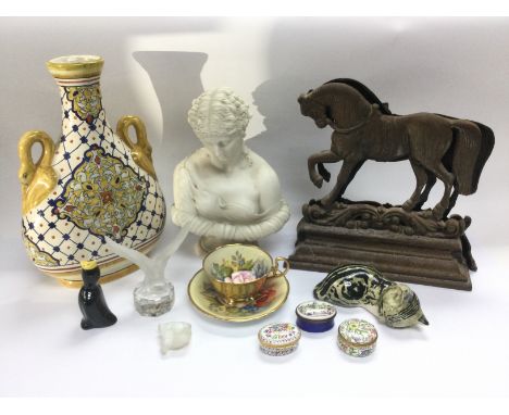A collection of items comprising an Aynsley cup and saucer, three enamel pill boxes, milk glass bird figure and other items. 
