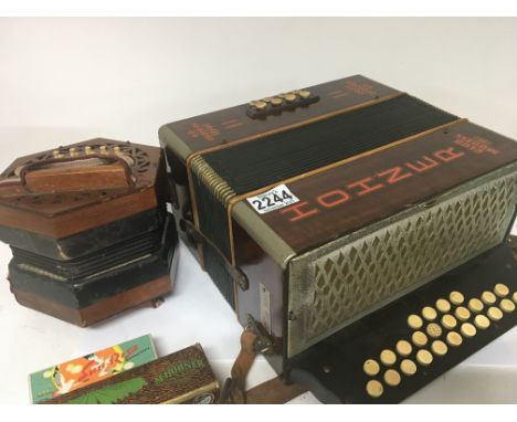 A Vintage Concertina with pierced wood ends bone keys maker Lachenal & Co London a Hohner Club model II accordion and two box