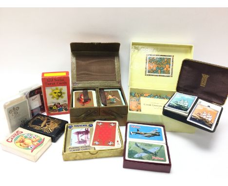 A collection of various vintage sets of cards including Tarrot cards, Playing cards, William Morris card game etc. postage ca