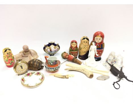 A collection of items including bone, corkscrew puppet, tortoise shell etc.