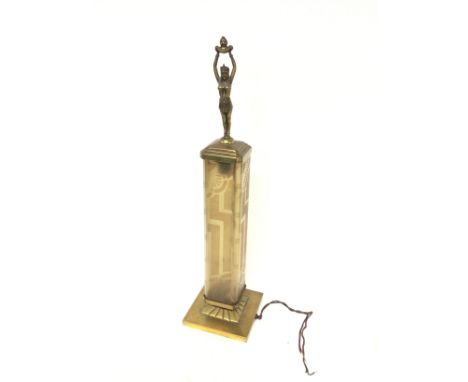 An Art Deco table lamp with a rectangular glass shade , mounted with a bronzed Egyptian-style lady. 58cm tall. Postage catego