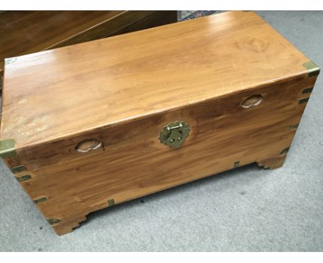 A Camphor wood trunk with applied brass fittings maker Hing Hop Hong Kong. 94x45cm
