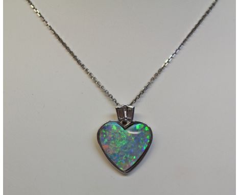 Heart shape opal and baguette diamond pendant on chain necklace hallmarked 9ct Condition Report Click here for further images