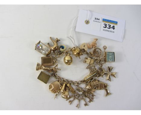 Gold chain bracelet hallmarked 9ct with charms mostly hallmarked 9ct or stamped 14k approx 57gm Condition Report Click here f